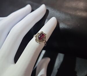 Elegant Garnet Ring with Intricate Design